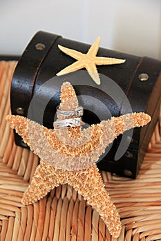 Wedding ring set with starfish, in beach-themed ceremony