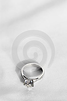 wedding ring on white fabric