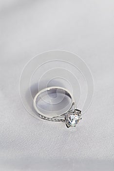 wedding ring on white fabric