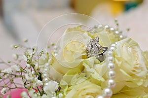 Wedding Ring on White Roses