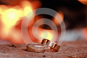 Wedding rings against the background of fire