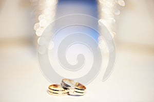 Wedding rings on the background of beautiful bokeh