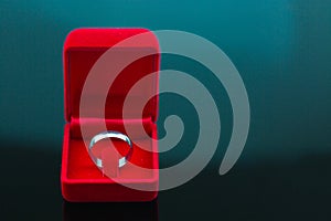 Wedding rings background, beautiful silver ring in red box for wedding concept