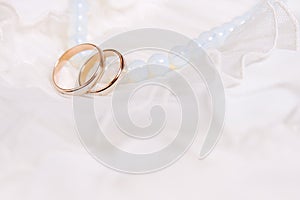 Wedding rings and blue beads