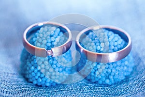 Wedding rings on blue candies