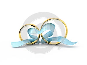 Wedding rings with a blue ribbon in a heart shape isolated on white