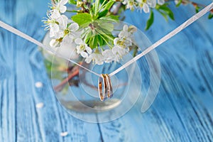 Wedding rings on a branch. Spring bouquet of cherry flowers