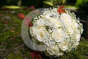 Wedding rings on bridal bouquet