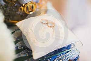 Wedding rings on ceremony at church. Macro.