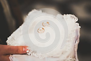 Wedding rings on ceremony at church. Macro.