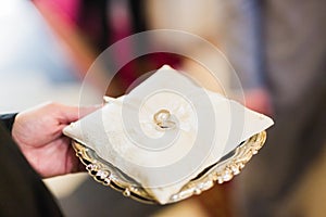 Wedding rings on ceremony at church. Macro.