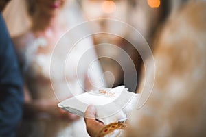 Wedding rings on ceremony at church. Macro.