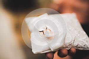 Wedding rings on ceremony at church. Macro.