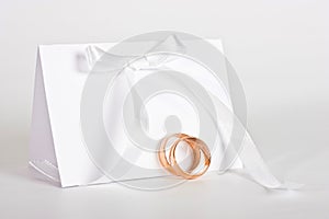 Wedding rings and complimentary ticket