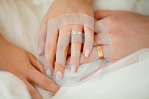 Wedding Rings on Couple Hands, Bridal White Dress