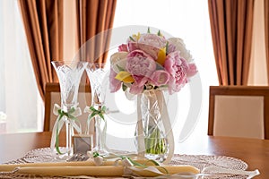 Wedding rings, cups and flowers