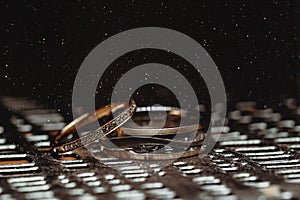 Wedding rings on a dark background