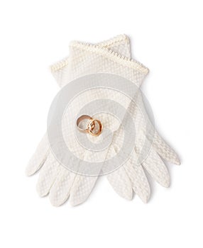 Wedding rings and delicate gloves