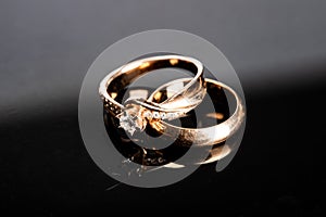 wedding rings, diamond ring on black background