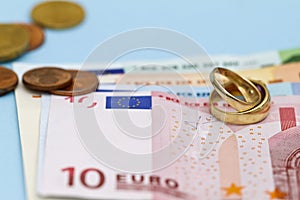 Wedding rings on Euro money
