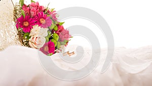 Wedding rings and flower bouquet