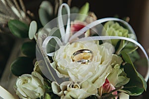 Wedding rings on flowers