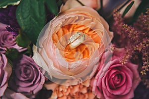 Wedding rings on flowers