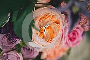 Wedding rings on flowers