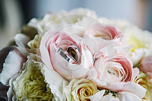 Wedding rings on flowers