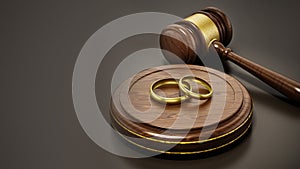 Wedding rings and gavel on dark background. 3D illustration