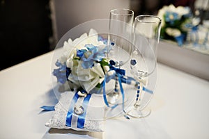 Wedding rings, goblets, flowers and accessories