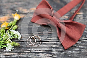 Wedding rings on the groom tie