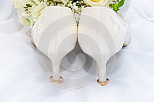 Wedding rings and high heel sandal