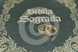 Wedding rings on a holy bible