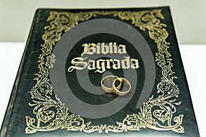 Wedding rings on a holy bible