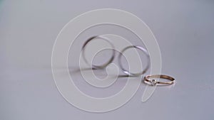 Wedding rings jewelry. Three gold rings on white background isolated.