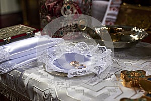 Wedding rings laid out on a plate in the Orthodox Church