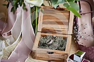 Wedding rings lie in the wooden box