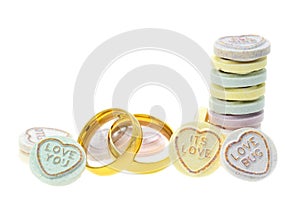 Wedding rings and Loveheart candy sweets photo