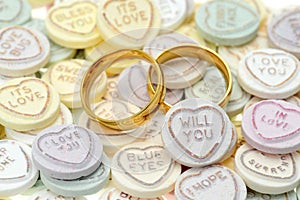 Wedding rings and Loveheart candy sweets photo