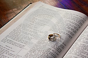 Wedding rings lying on Bible