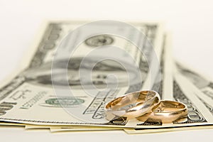 Wedding rings and money photo