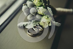 Wedding rings near boutonniere