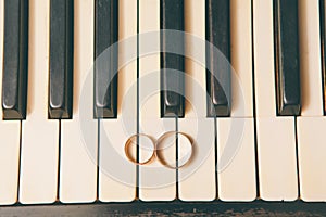 Wedding rings on a piano