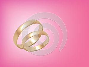 Wedding rings on pink background