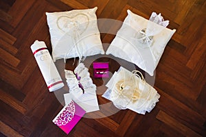 Wedding rings in pink box, garter, pincushion, letter