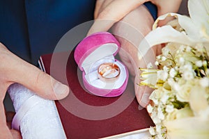 Wedding Rings in Pink Box on Marriage Certificate