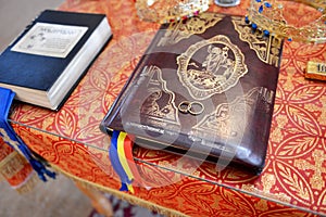 Wedding rings on prayer book