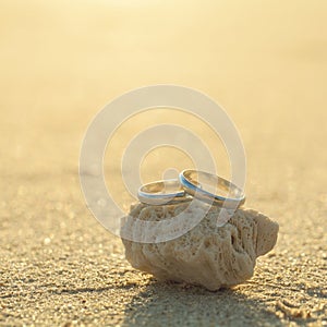 Wedding rings put on the beach