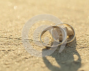 Wedding rings put on the beach